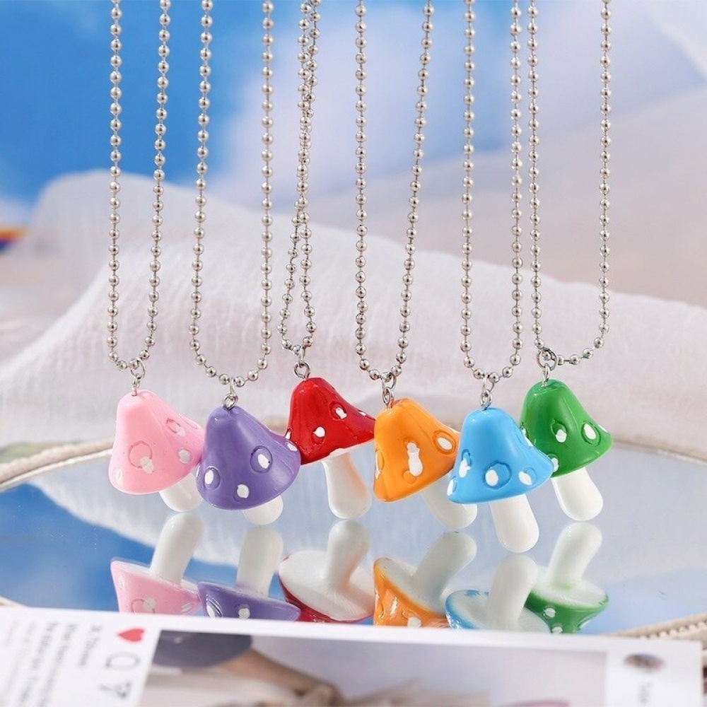 Harsketting met gekleurde paddenstoelhanger met witte stippen en zilveren ketting