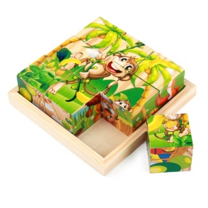 kubuspuzzel met bosmotief in groen en oranje in een houten doosje