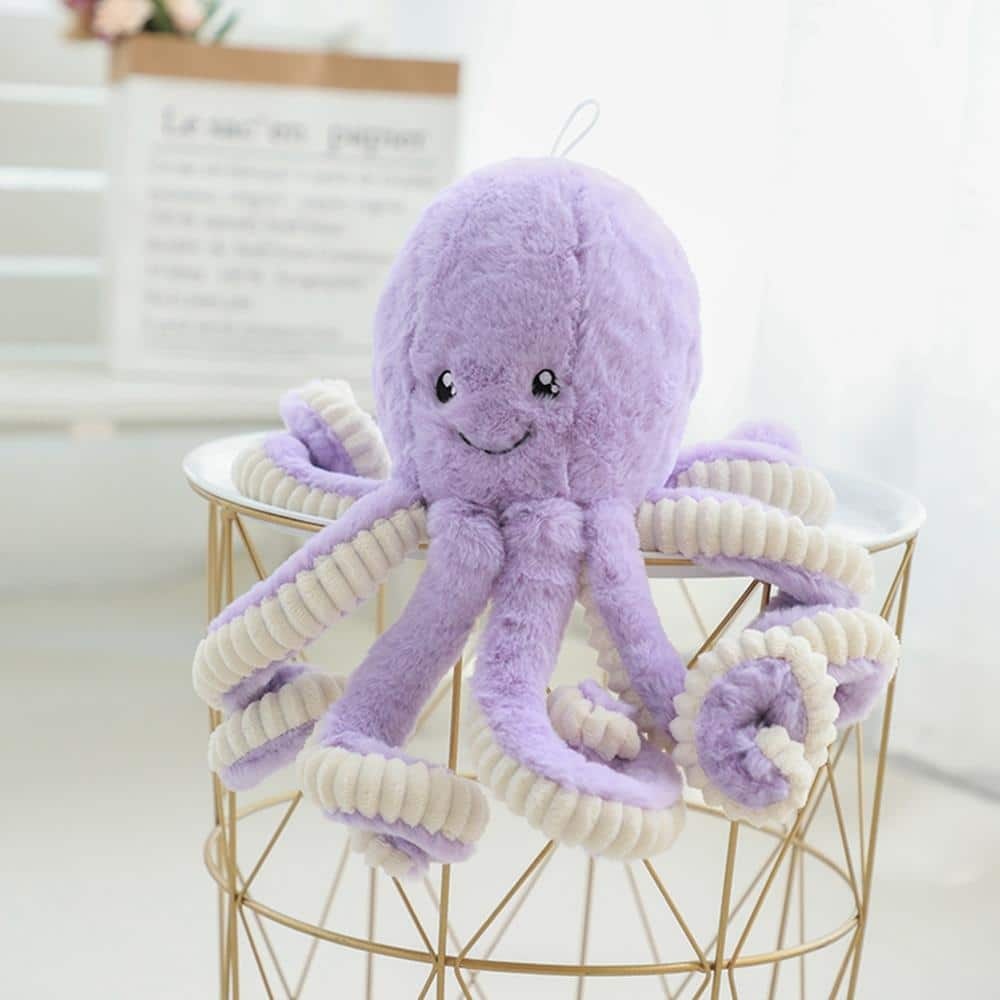 Superleuke octopus pluche Superleuke octopus pluche in paars op een gouden en wit nachtkastje